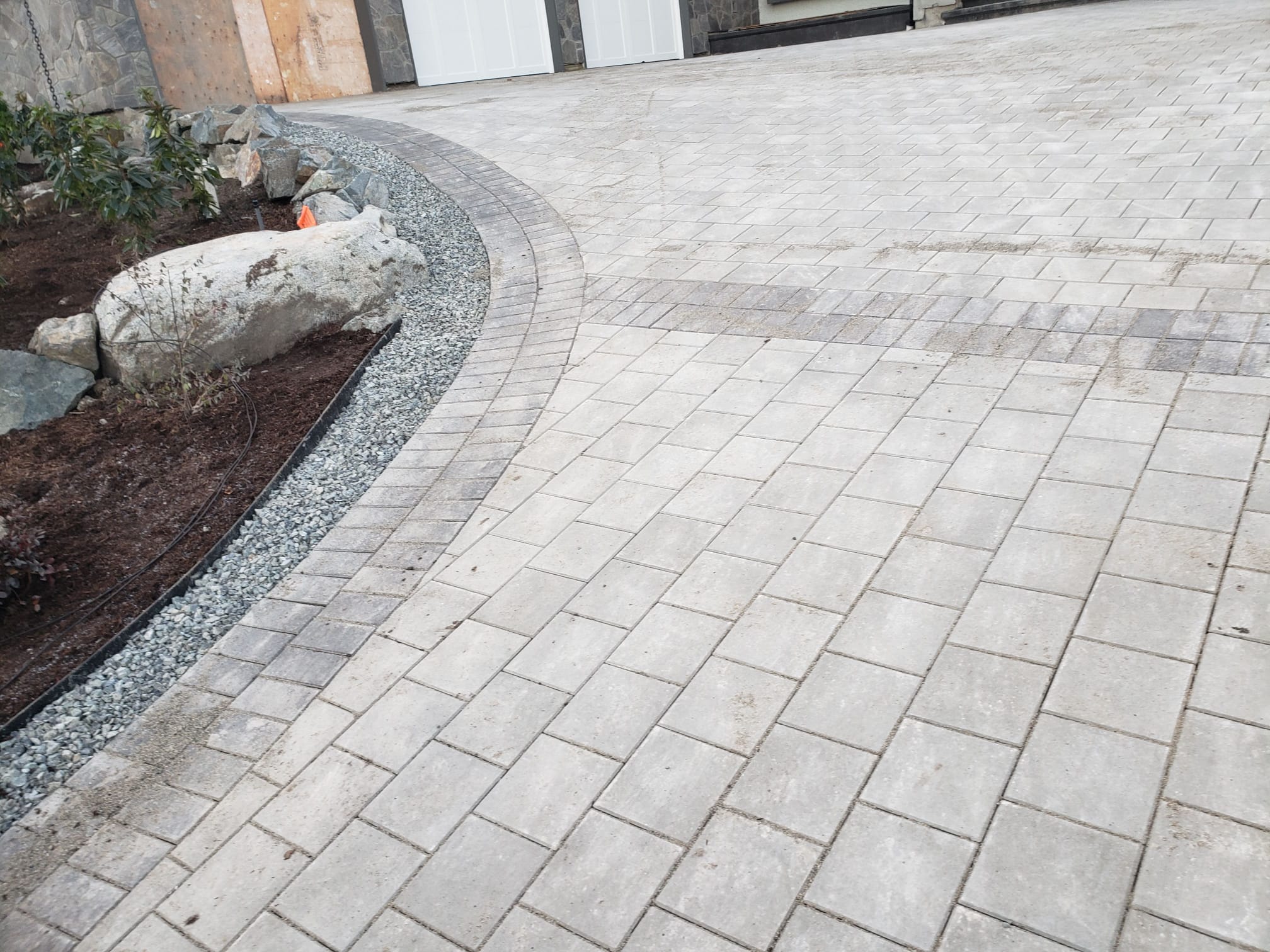 Detailed curved paver installation by DKA Landscaping