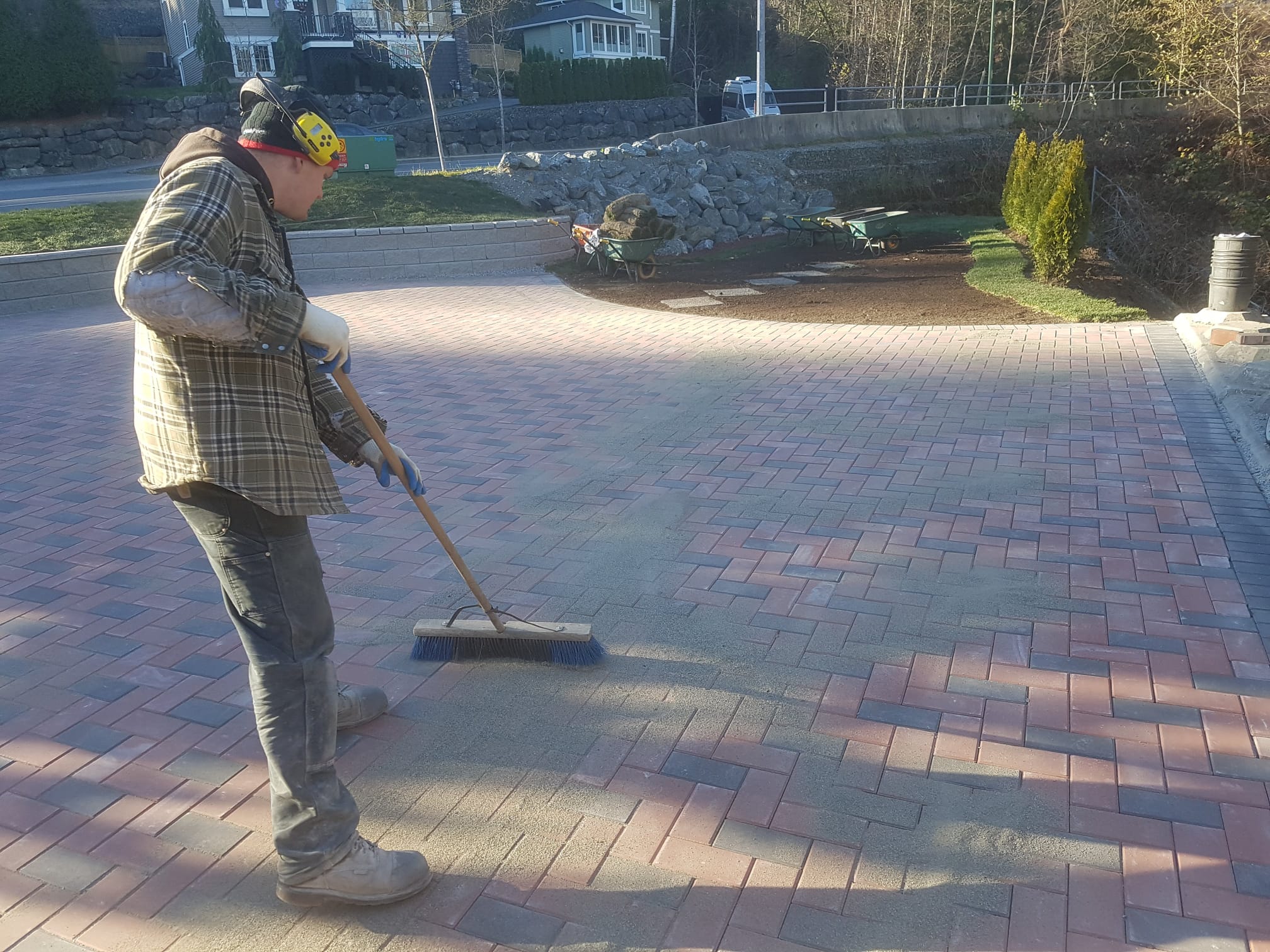 DKA team member finishing a paver driveway